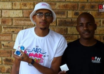 Phathutshedzo Netshimboni, on the left with a friend at the launch of his condoms. Picture : Tebogo Mokwena