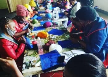 Keitumetse Molapo and her team hard at work knitting carpets