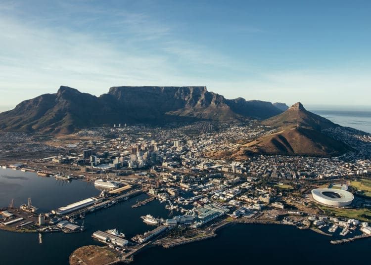 Aerial coastal view of cape town city with table mountain, cape town harbour, lions head and devils peak, South africa.