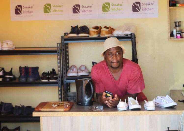 Lutendo Tshikovhi whose business is cleaning sneakers
