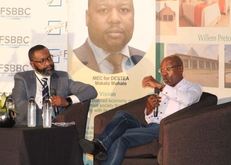 University of Free State’s Chancellor Bonang Mohale with Willie Choene