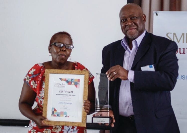 Business Partner CEO David Morobe with winner Zama Ngwenya