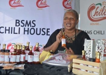Babe Masuge showcasing different chilli sauces that she makes