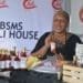 Babe Masuge showcasing different chilli sauces that she makes