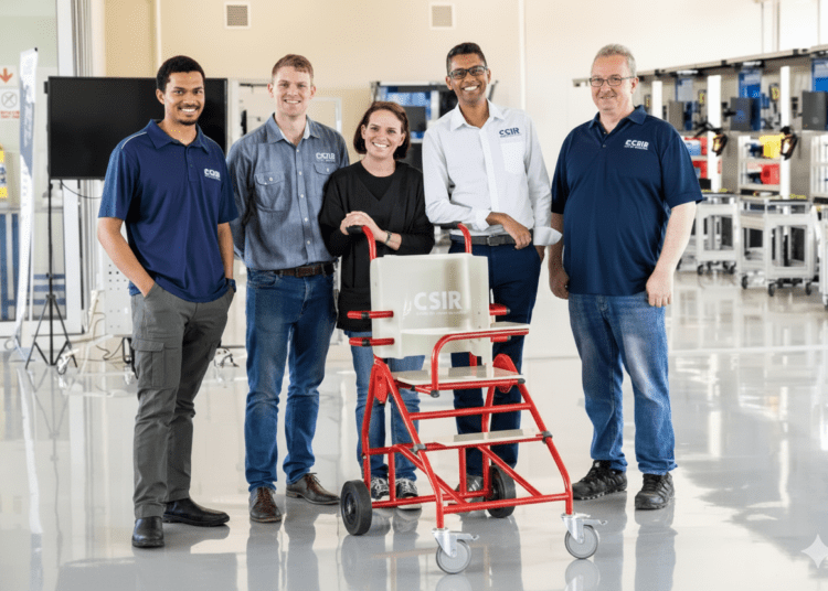 CSIR robotics experts Dr Sunveer Matadin (white shirt) and community health worker and disability consultant Ruth Stubbs with the Buddy4Life cerebral palsy prototype device, 26 November 2025.