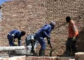 Bricklayers and small construction teams operating as micro-enterprises, often without formal registration, access to finance, or long-term contracts.