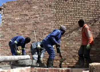 Bricklayers and small construction teams operating as micro-enterprises, often without formal registration, access to finance, or long-term contracts.