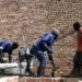 Bricklayers and small construction teams operating as micro-enterprises, often without formal registration, access to finance, or long-term contracts.