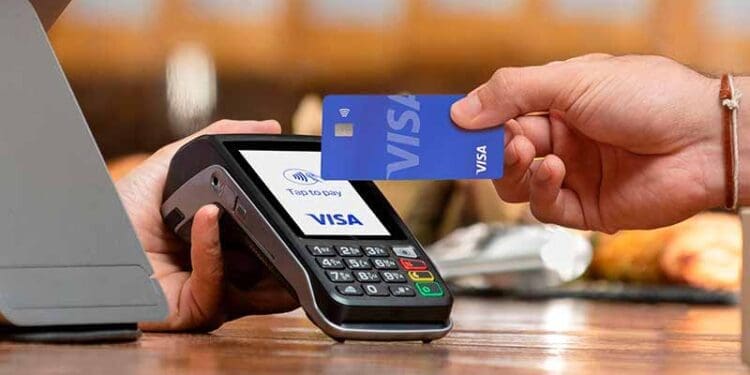 Small businesses charge extra for card transactions to cover bank costs. Photo. VISA