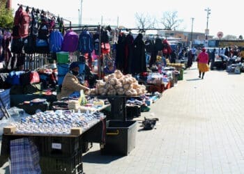 Informal traders keep local economies running despite challenges with costs, permits, and support.