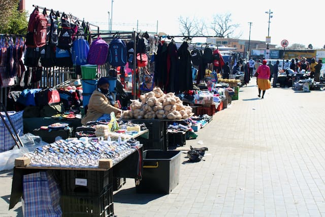 Informal traders keep local economies running despite challenges with costs, permits, and support.