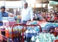 Receiving R40 000 worth of stock for his spaza shop is more than a business transaction for Umlazi trader Nkanyiso Eric Ngobese (wearing hat)
