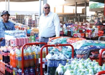 Receiving R40 000 worth of stock for his spaza shop is more than a business transaction for Umlazi trader Nkanyiso Eric Ngobese (wearing hat)