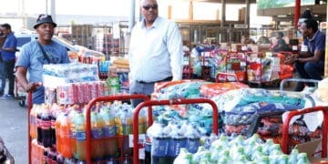 Receiving R40 000 worth of stock for his spaza shop is more than a business transaction for Umlazi trader Nkanyiso Eric Ngobese (wearing hat)